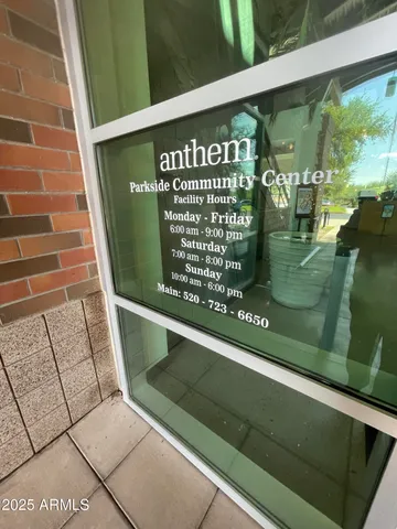a dining room with furniture water view and large windows