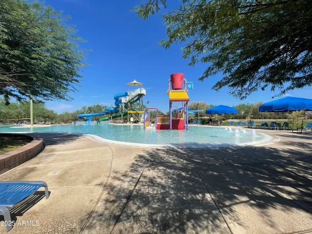 a view of a swimming pool with a patio
