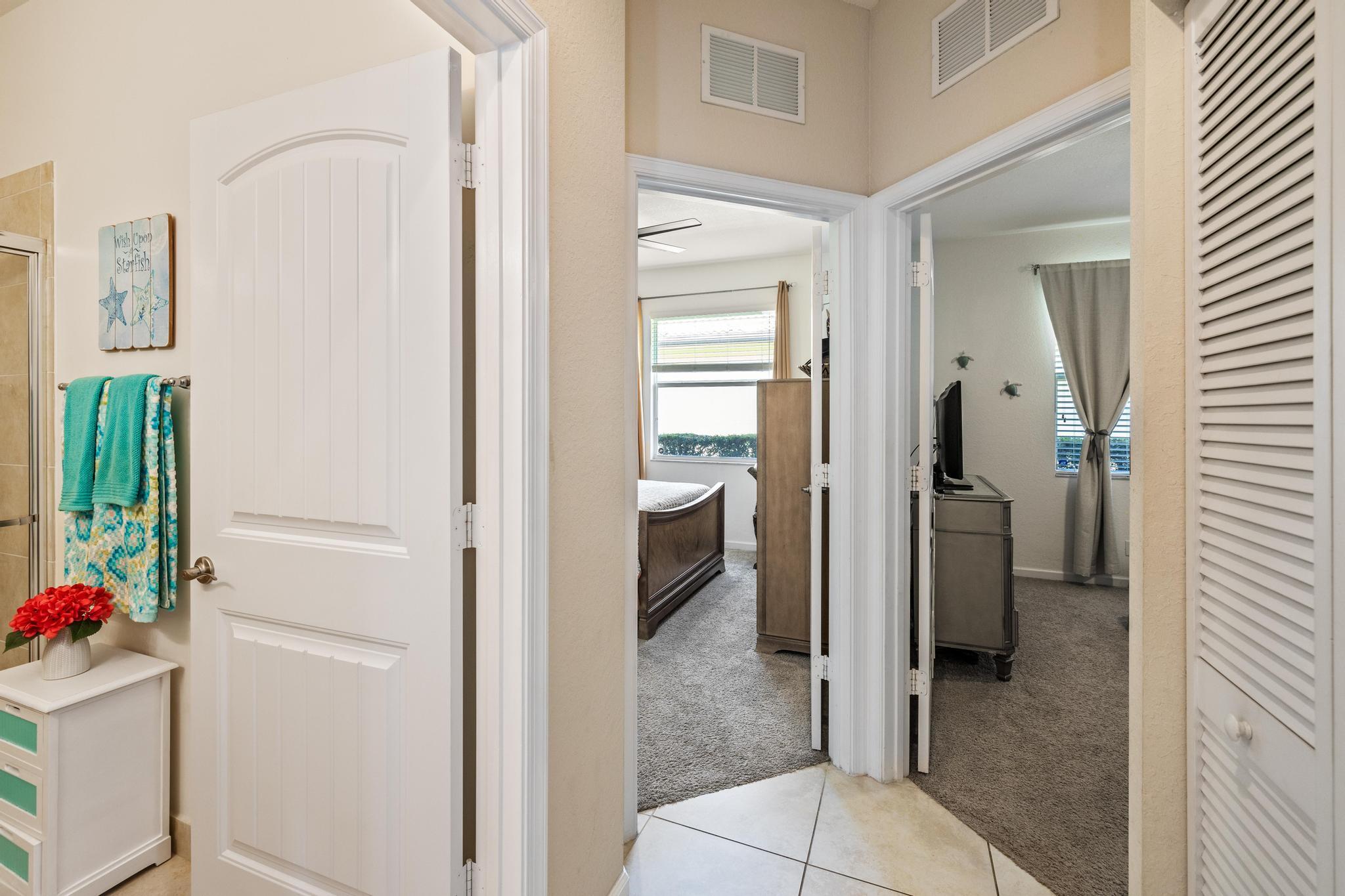 7034 Limestone Cay Road Jupiter, FL 33458 - Photo 20 of 43 a view of a hallway with dining room and cabinet