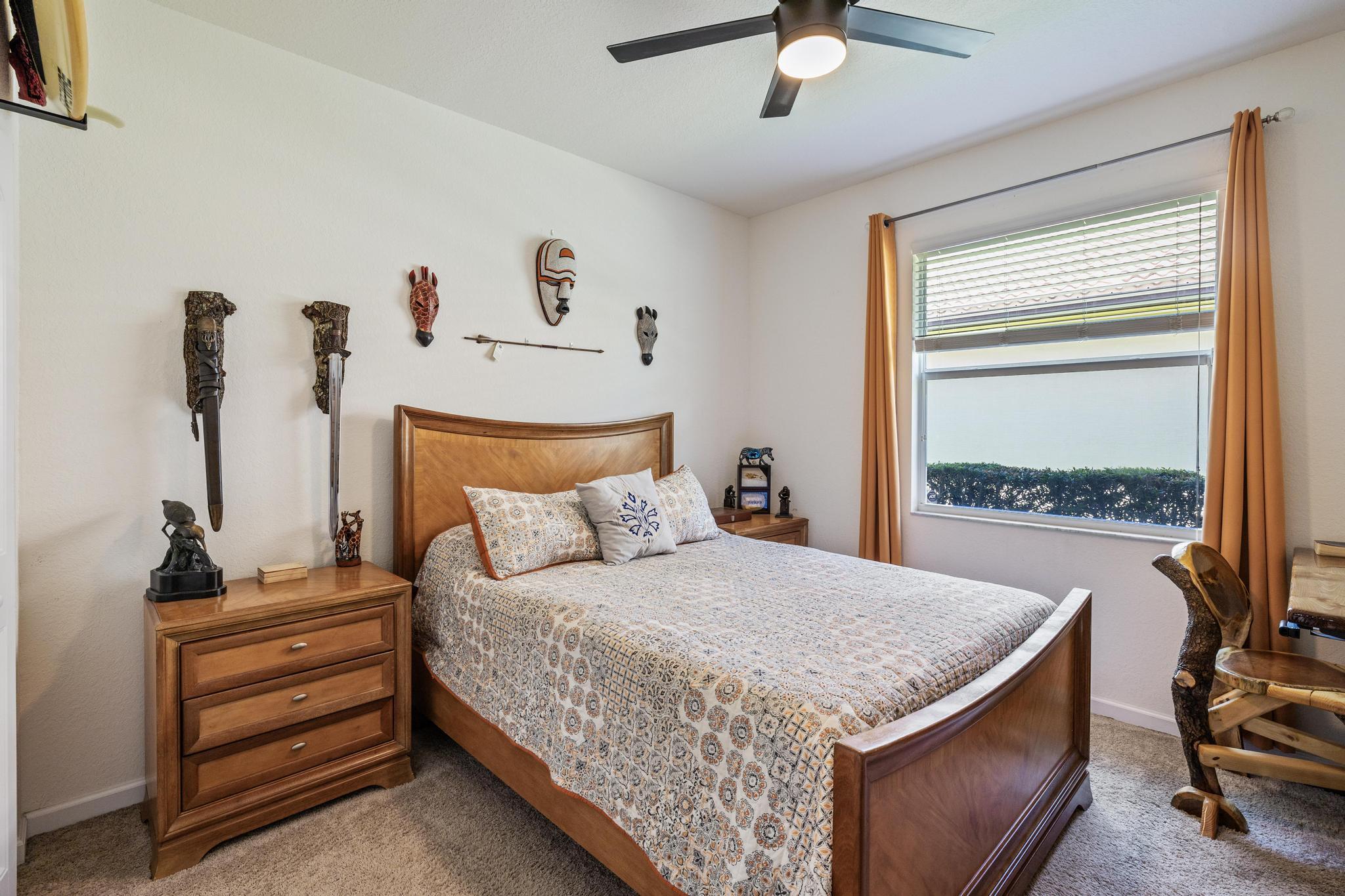 7034 Limestone Cay Road Jupiter, FL 33458 - Photo 22 of 43 a bedroom with a bed and a chandelier