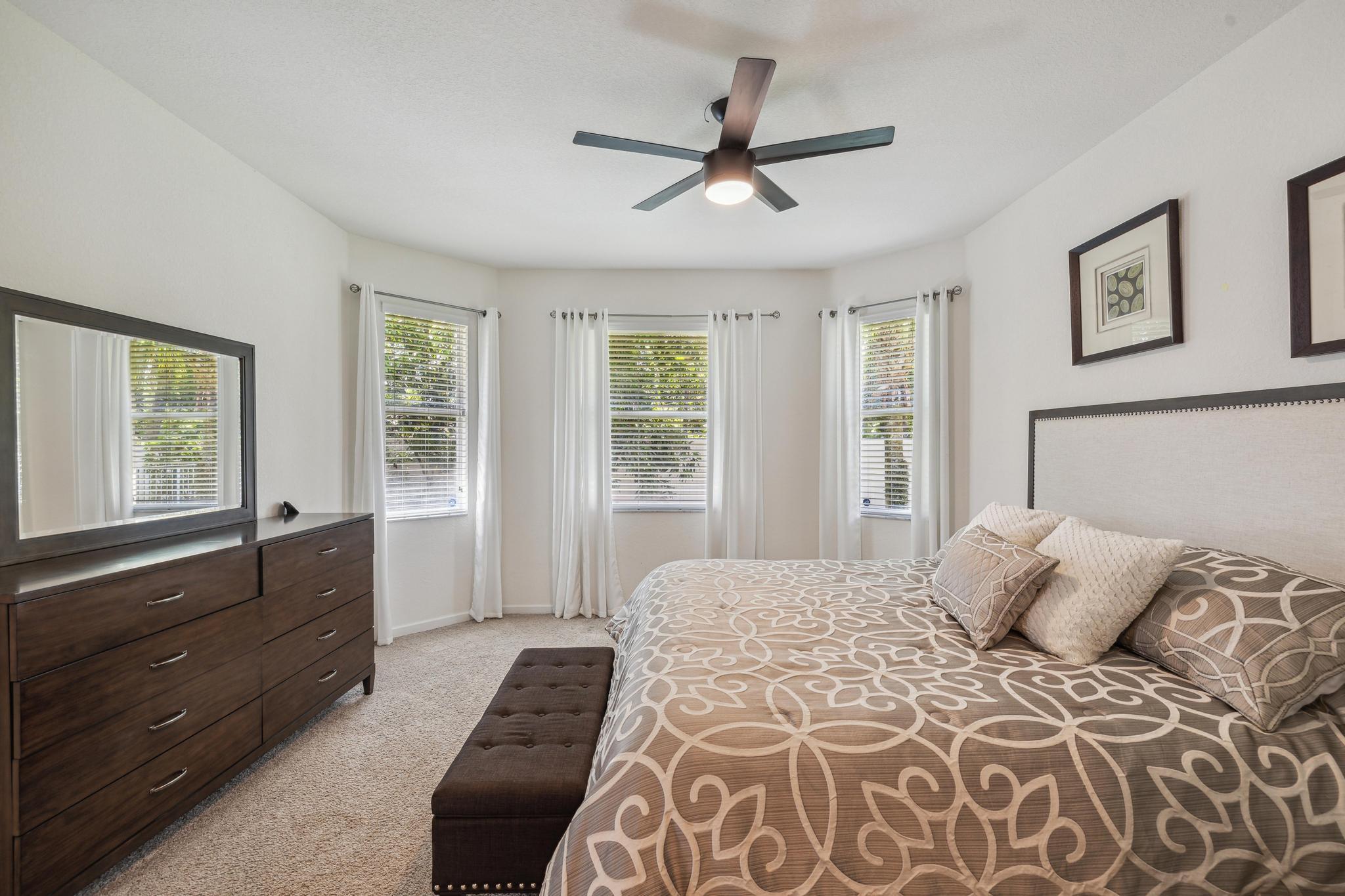 7034 Limestone Cay Road Jupiter, FL 33458 - Photo 25 of 43 a bedroom with a large bed and a window