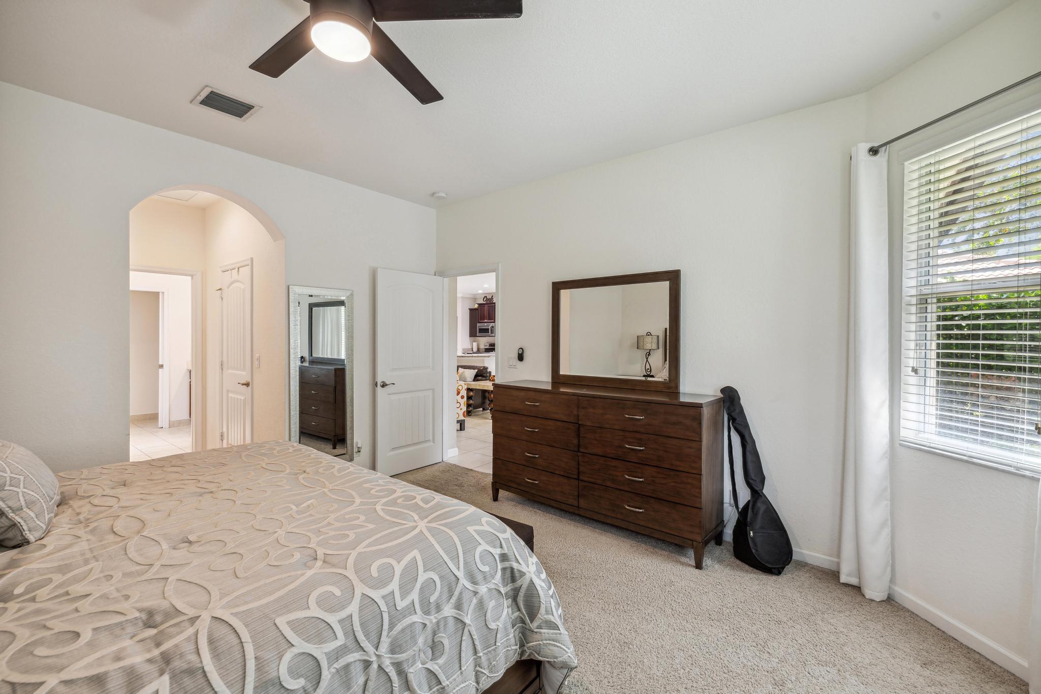 7034 Limestone Cay Road Jupiter, FL 33458 - Photo 26 of 43 a bedroom with a bed and a dresser