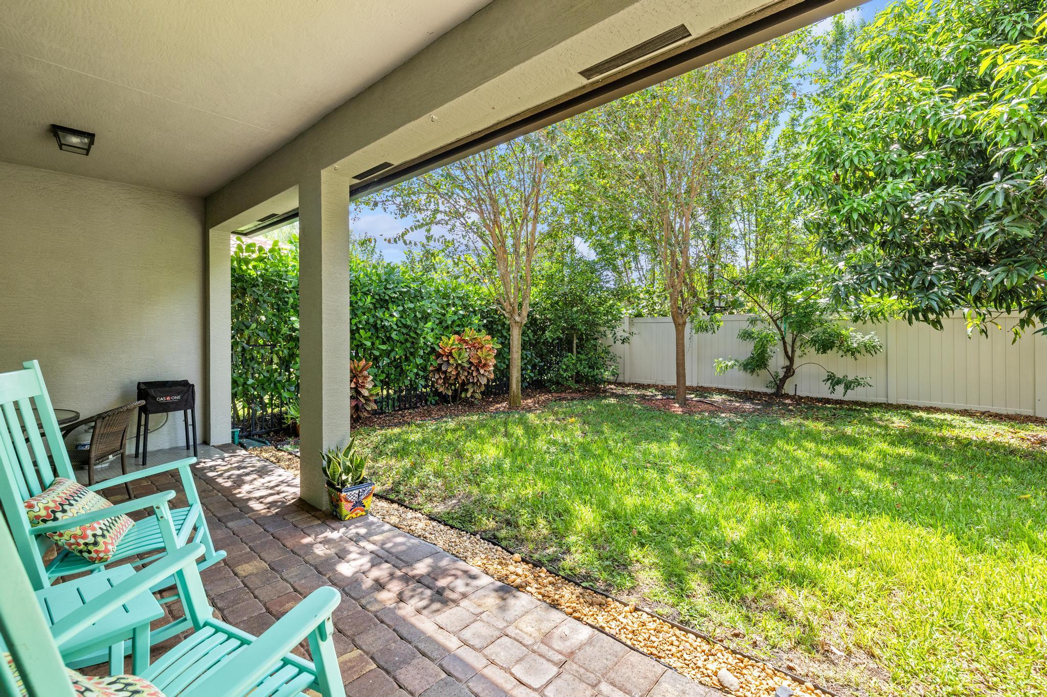7034 Limestone Cay Road Jupiter, FL 33458 - Photo 29 of 43 a house view with a garden space