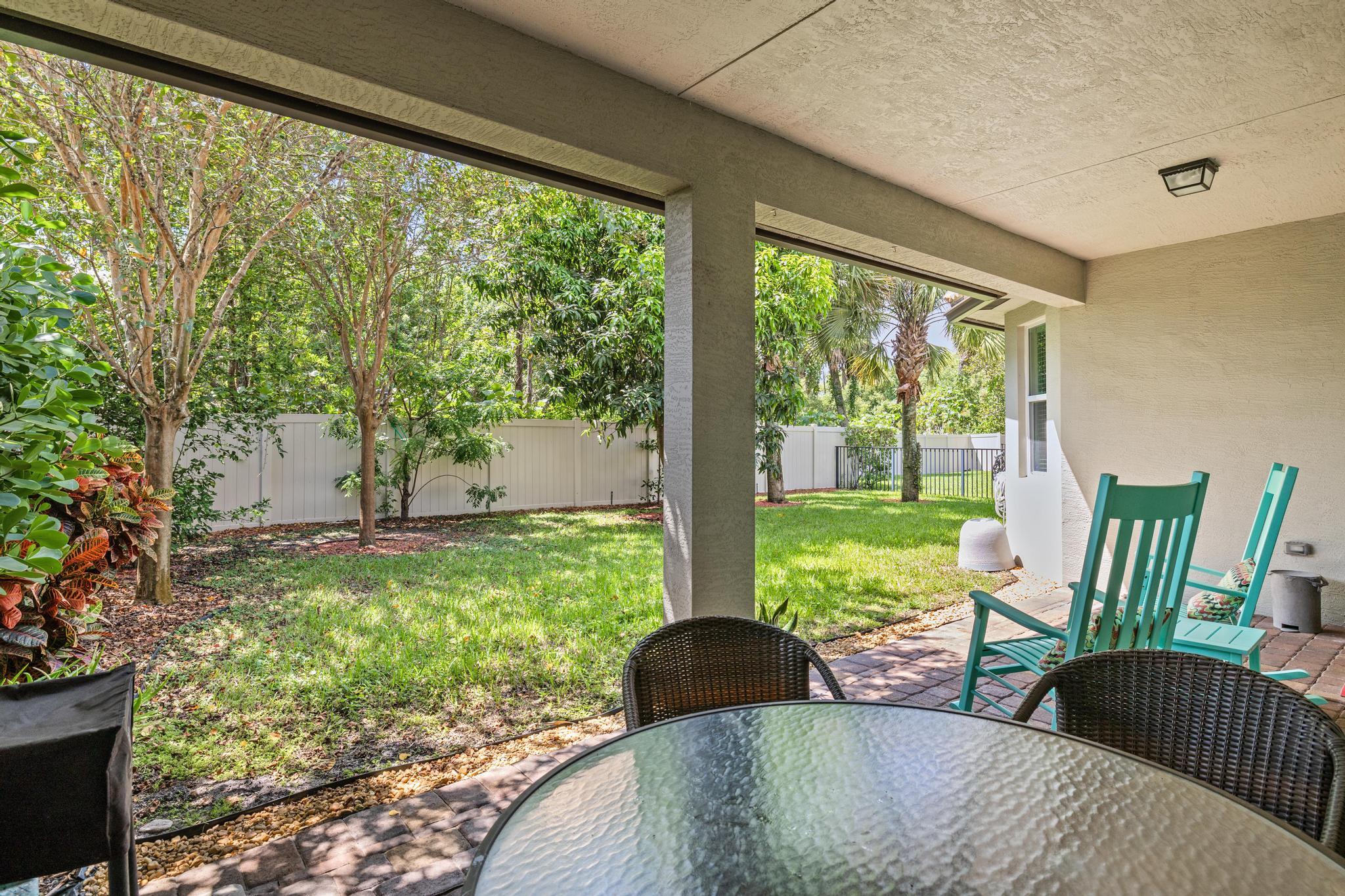 7034 Limestone Cay Road Jupiter, FL 33458 - Photo 30 of 43 a living room with a couch and a large window