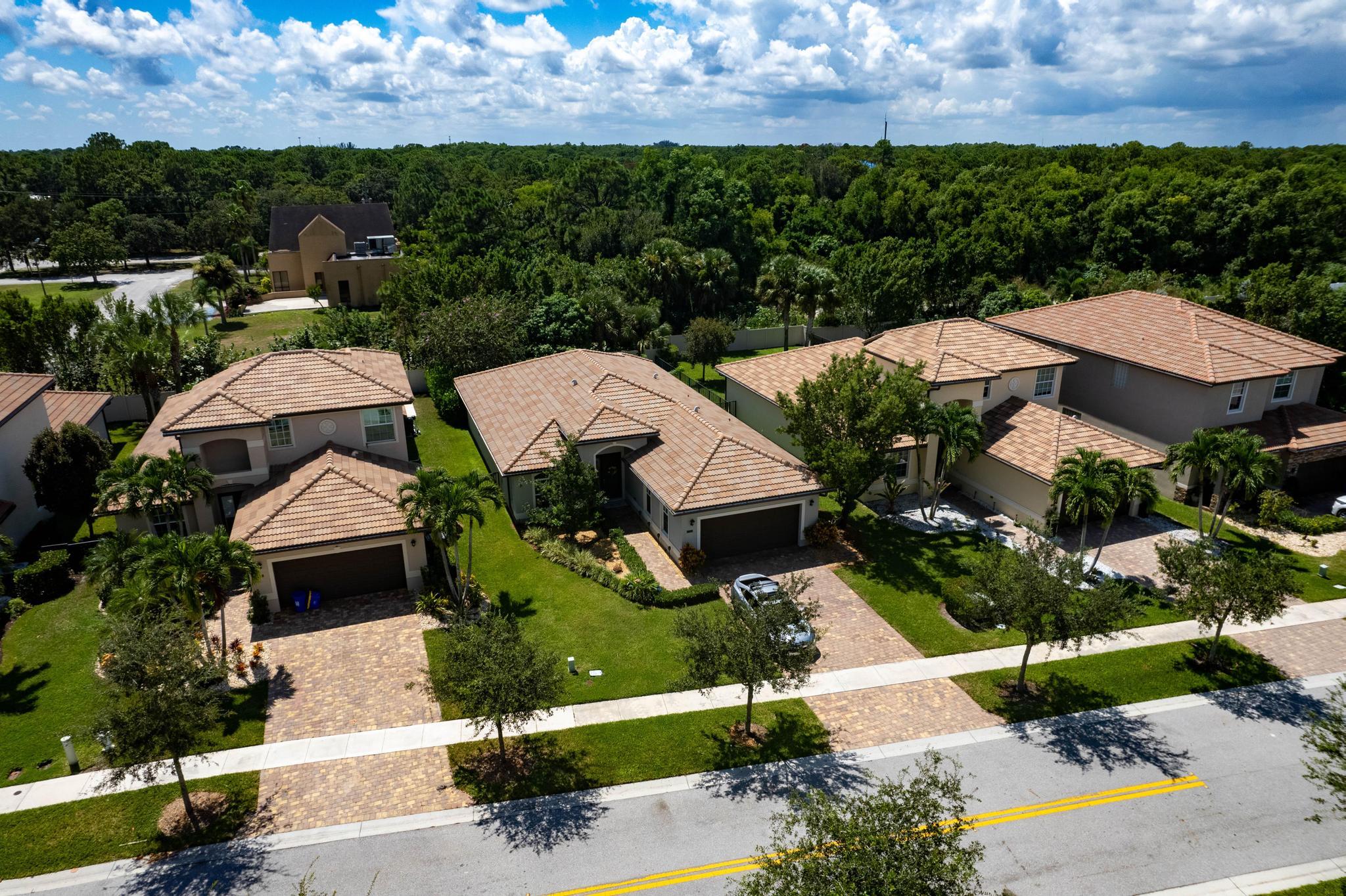 7034 Limestone Cay Road Jupiter, FL 33458 - Photo 35 of 43 an aerial view of a houses with a garden