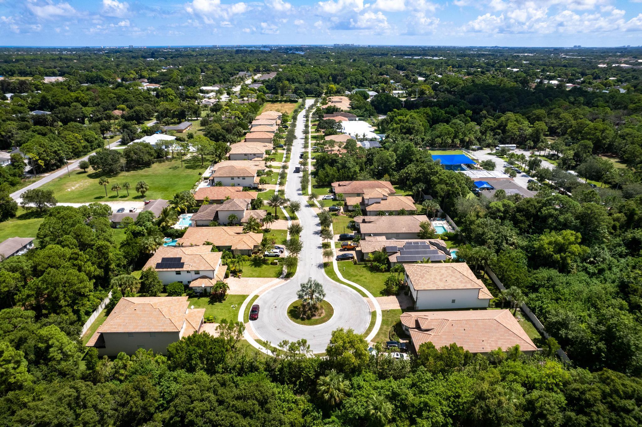 7034 Limestone Cay Road Jupiter, FL 33458 - Photo 39 of 43 an aerial view of multiple houses