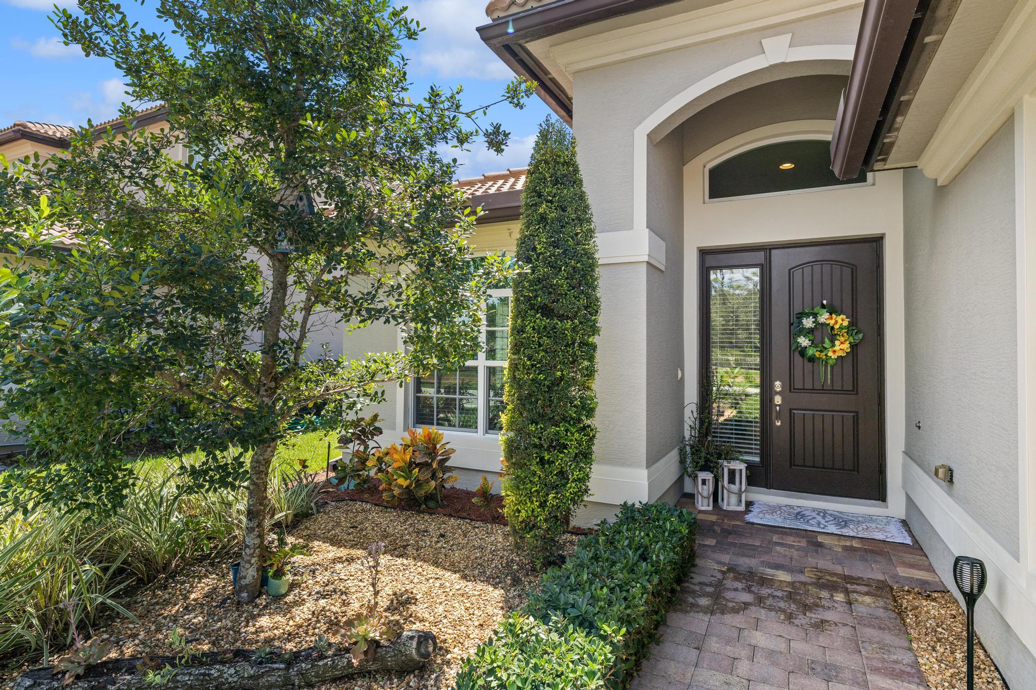 7034 Limestone Cay Road Jupiter, FL 33458 - Photo 6 of 43 a view of a entryway door of the house