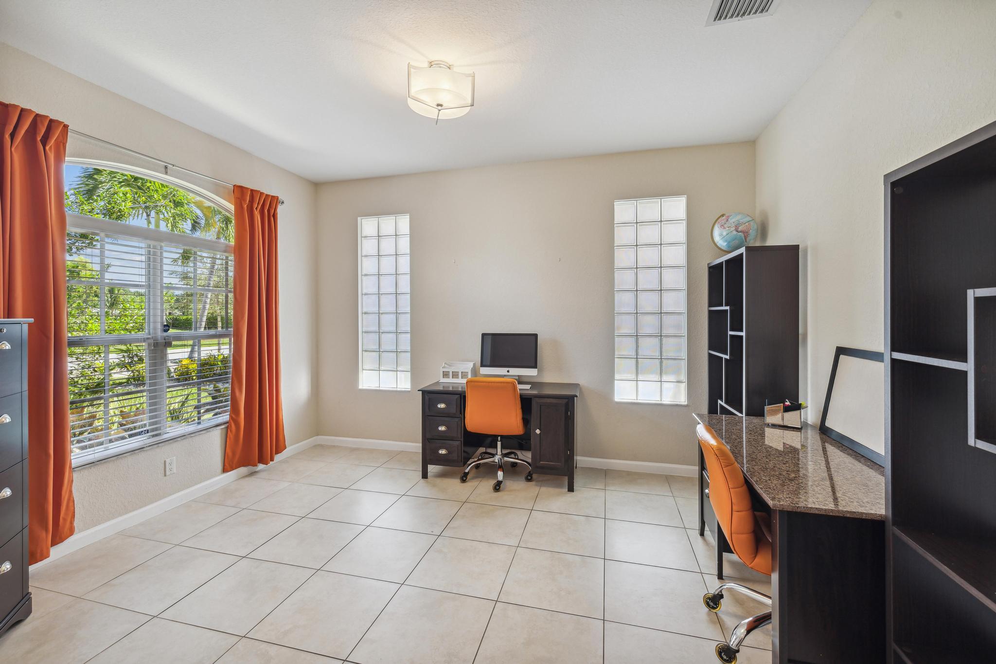 7034 Limestone Cay Road Jupiter, FL 33458 - Photo 8 of 43 a workspace with furniture and a window