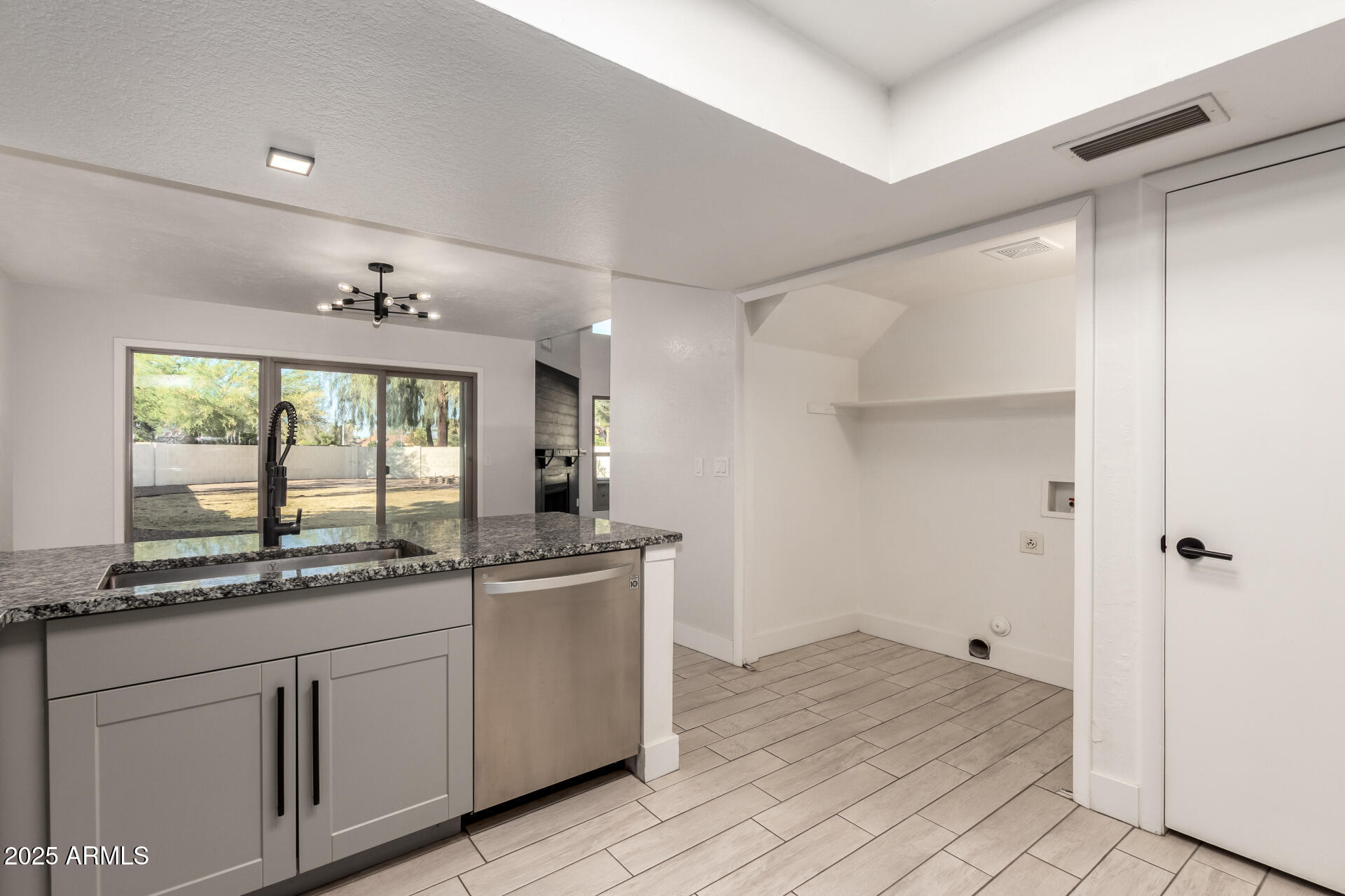 1621 North Chippewa Drive Chandler, AZ 85224 - Photo 12 of 25 a kitchen with a sink stove and cabinets
