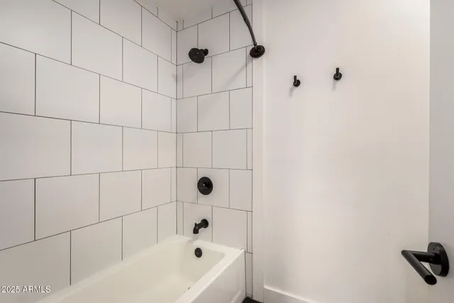 a bathroom with a double vanity sink mirror and