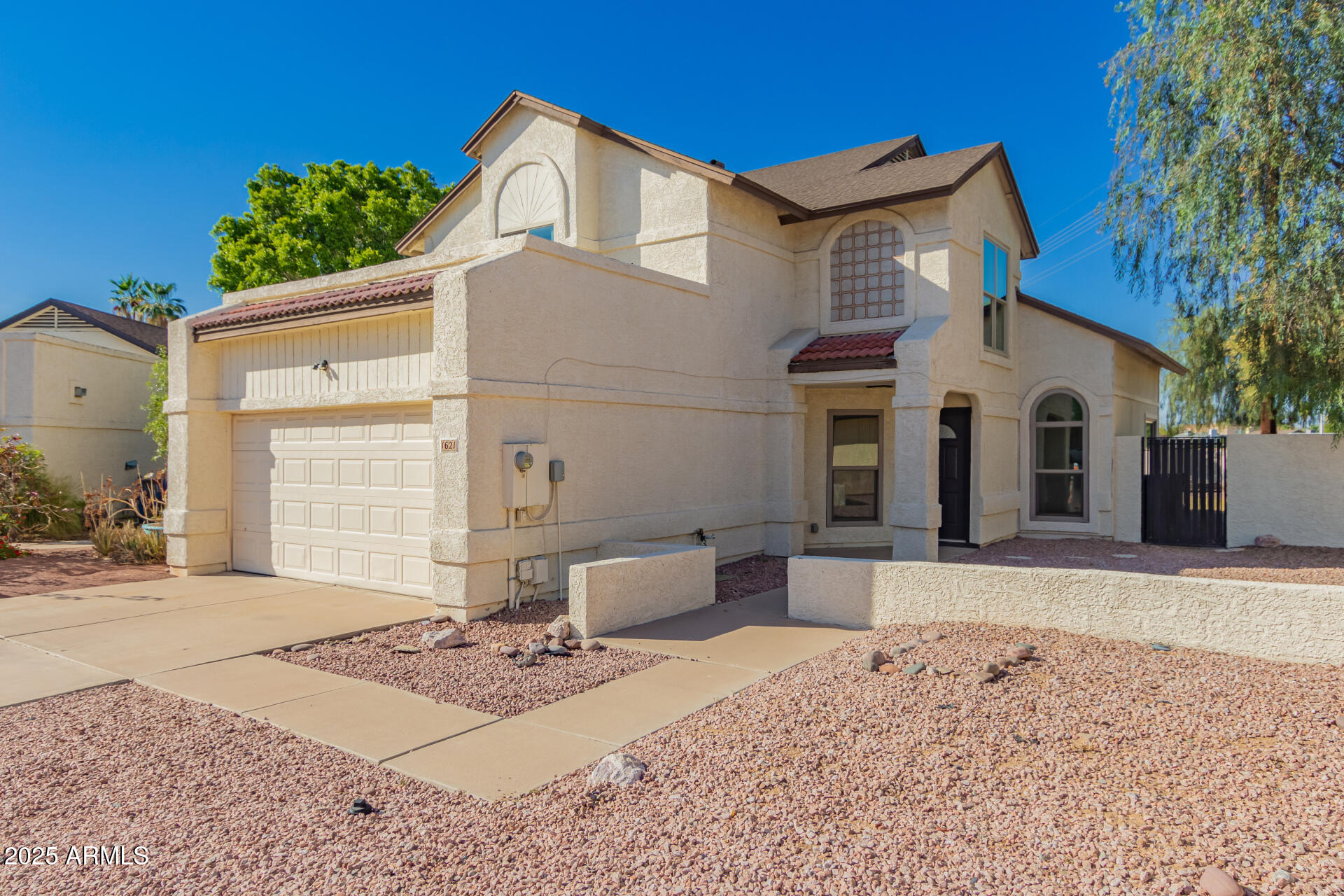 1621 North Chippewa Drive Chandler, AZ 85224 - Photo 2 of 25 a view of a white house with a outdoor space