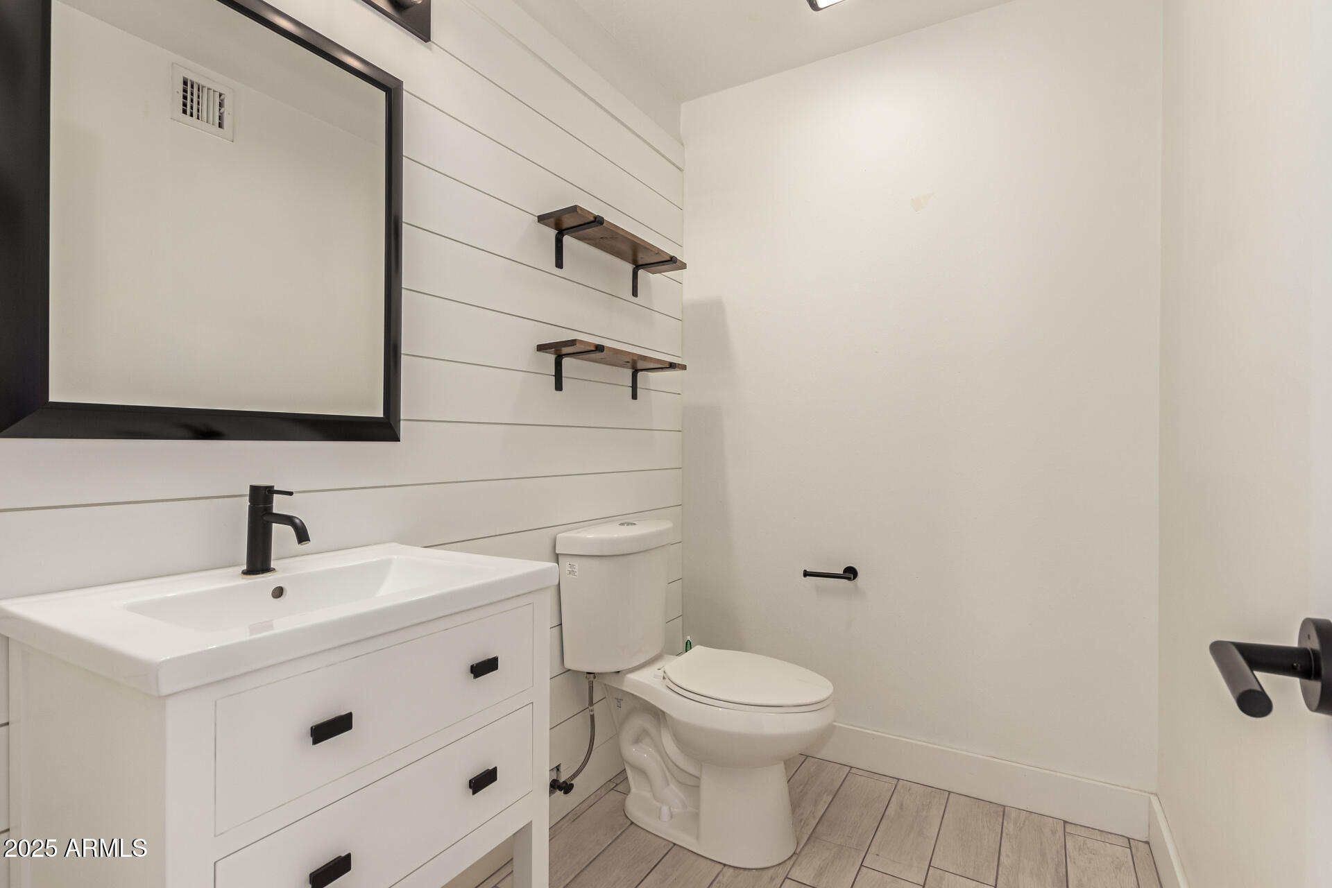 1621 North Chippewa Drive Chandler, AZ 85224 - Photo 22 of 25 a bathroom with a toilet sink and mirror
