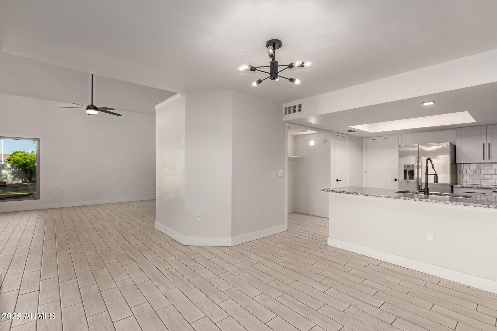1621 North Chippewa Drive Chandler, AZ 85224 - Photo 7 of 25 a view of a kitchen with a sink and wooden floor