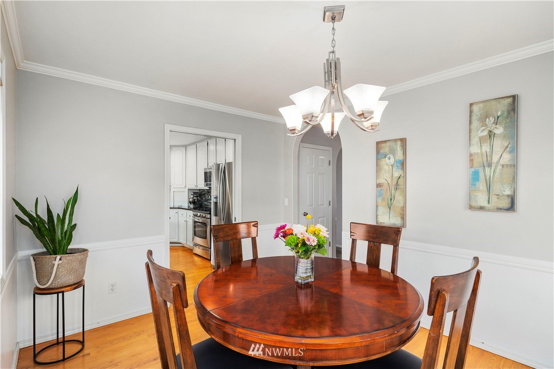 23221 14th Place West Bothell, WA 98021 - Photo 13 of 40 a dining room with furniture potted plants and wooden floor