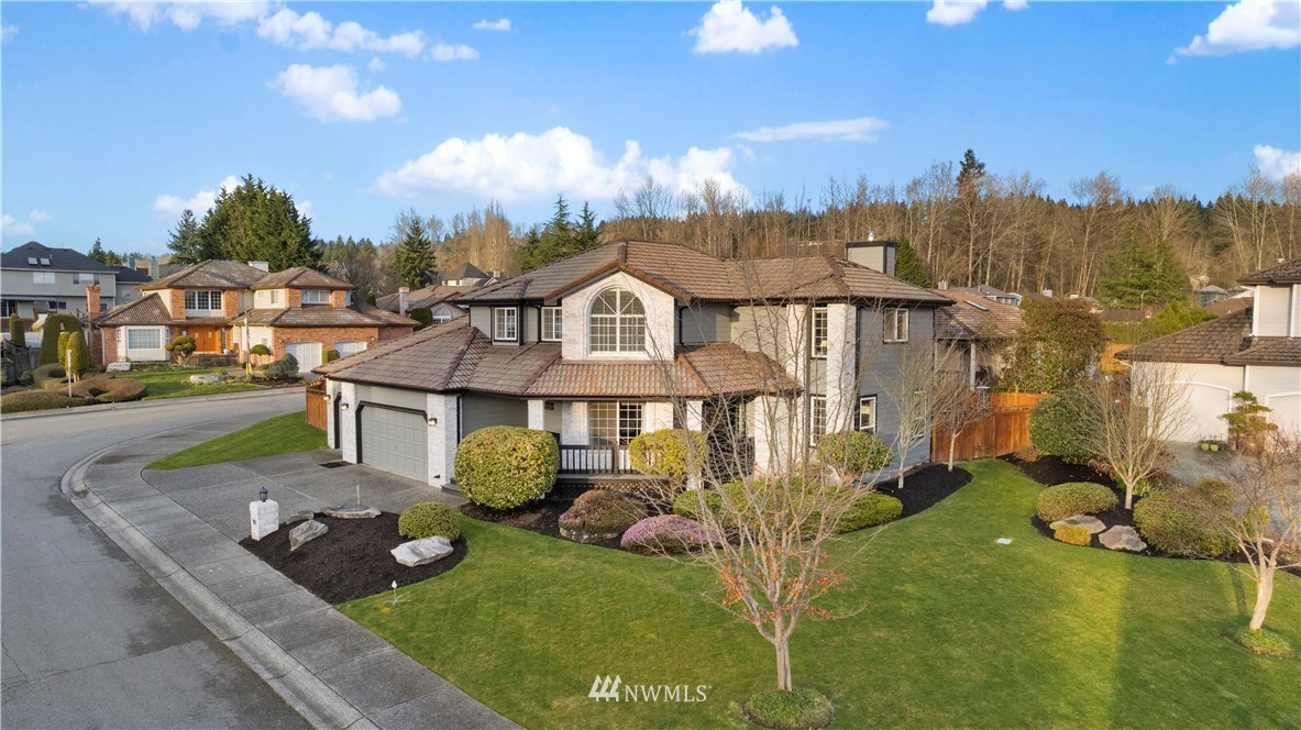 23221 14th Place West Bothell, WA 98021 - Photo 2 of 40 a front view of a house with garden