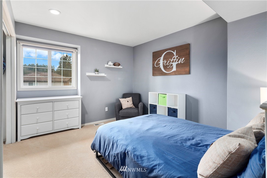 23221 14th Place West Bothell, WA 98021 - Photo 26 of 40 a bedroom with a bed and a window