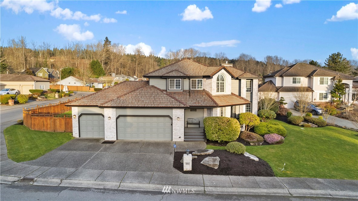 23221 14th Place West Bothell, WA 98021 - Photo 3 of 40 a front view of a house with a yard and garage