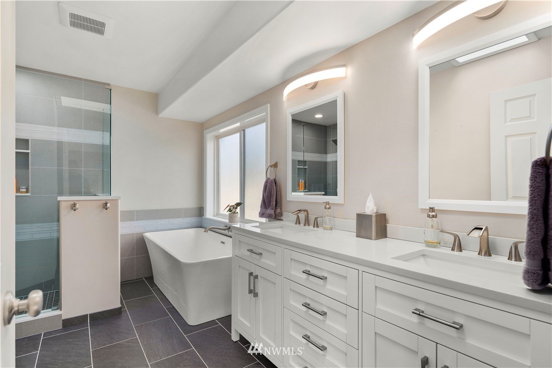 23221 14th Place West Bothell, WA 98021 - Photo 31 of 40 a bathroom with a double vanity sink mirror and bathtub