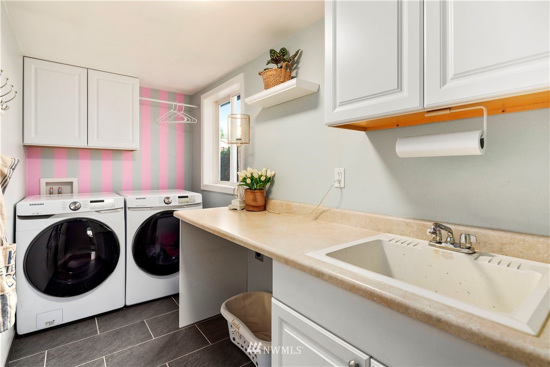 23221 14th Place West Bothell, WA 98021 - Photo 10 of 40 a utility room with sink dryer and washer