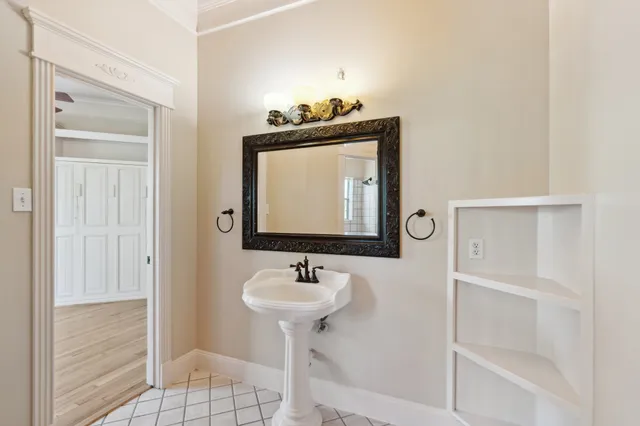 a bathroom with a sink and a mirror