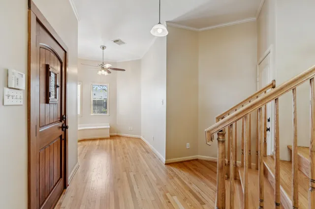 a view of an entryway with wooden floor