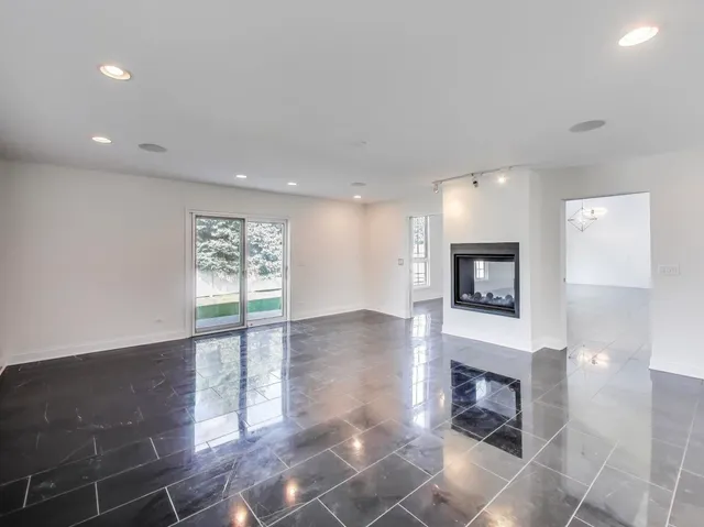 a view of a kitchen with a sink and a fireplace