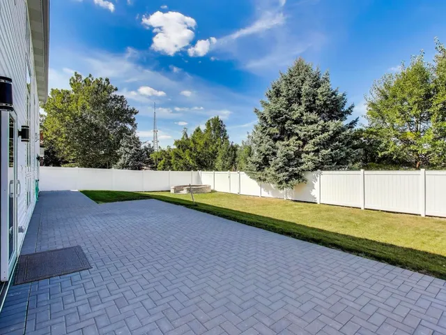 a view of a yard with swimming pool