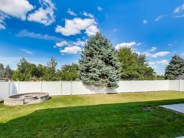 a view of a swimming pool with an outdoor space and seating area