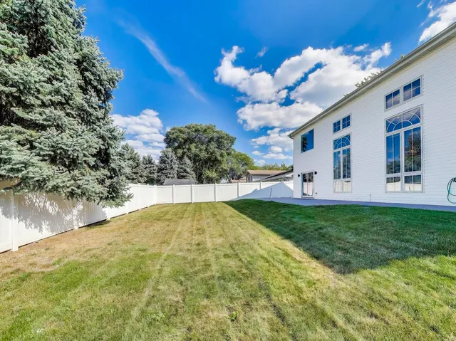 a view of a house with a big yard