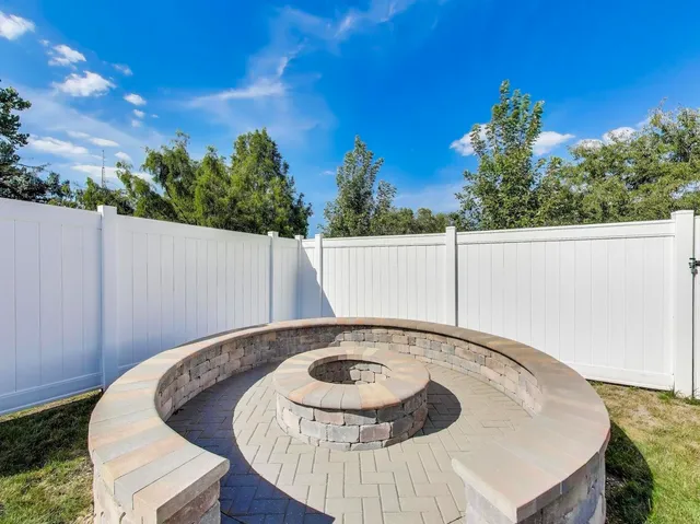 a view of a swimming pool with an outdoor seating