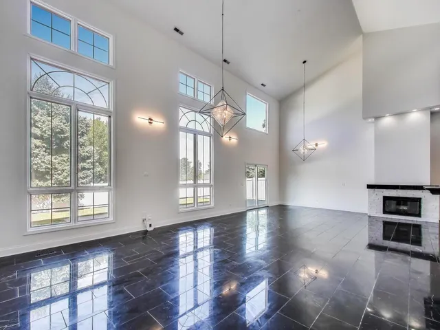 a view of a room with window and wooden floor