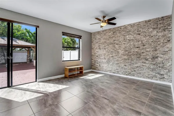 a kitchen with stainless steel appliances granite countertop a sink stove and microwave