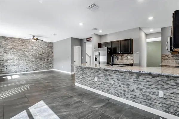 a bathroom with a bathtub and a sink