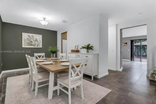 a view of an entryway with wooden floor