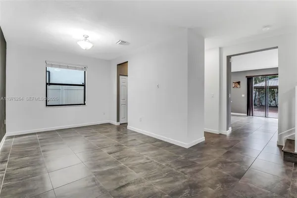 a view of an empty room with a window