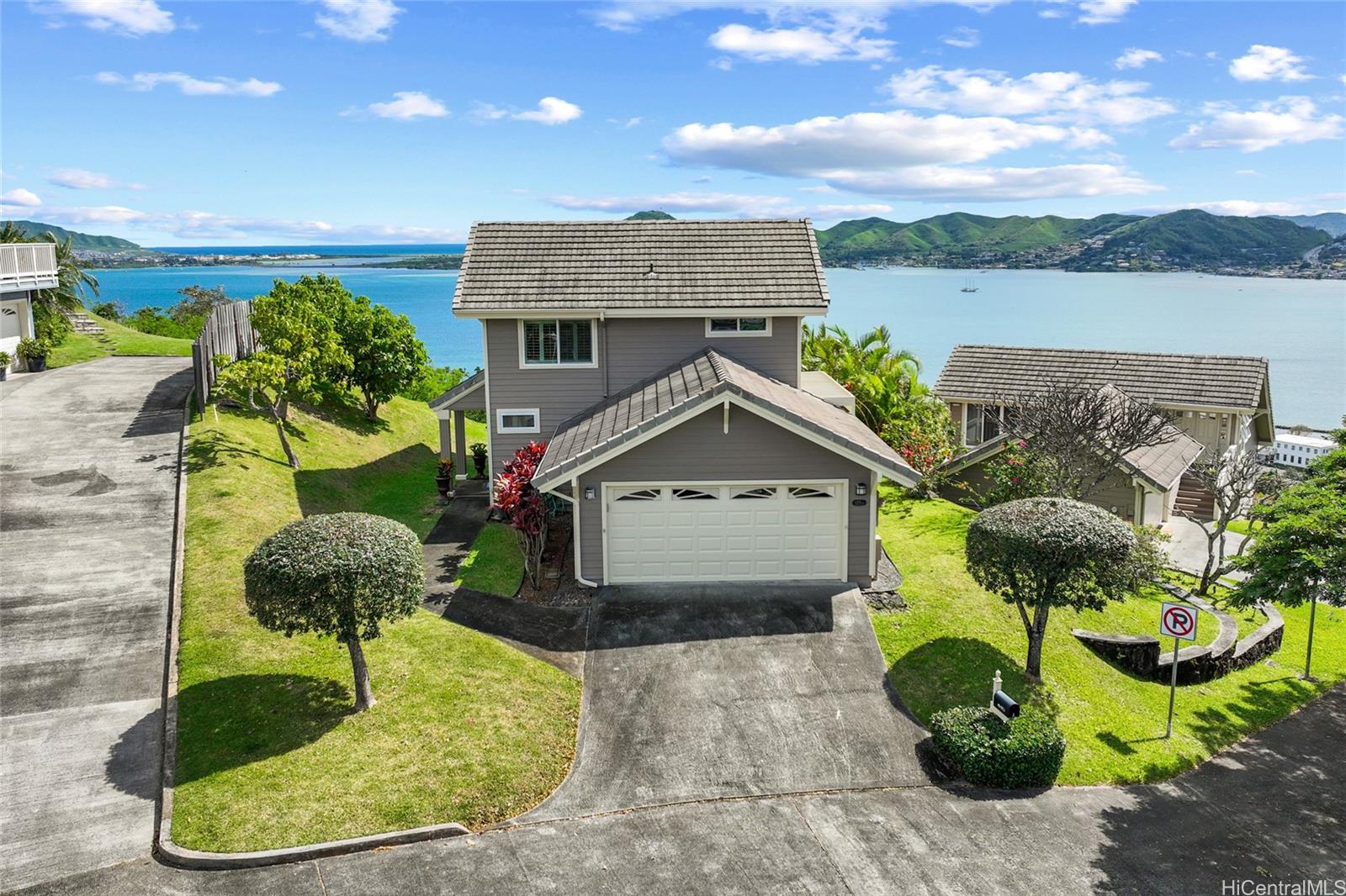 45-177 Lilipuna Road, Unit J Kaneohe, HI 96744 - Photo 1 of 1 a front view of a house with a yard and outdoor seating