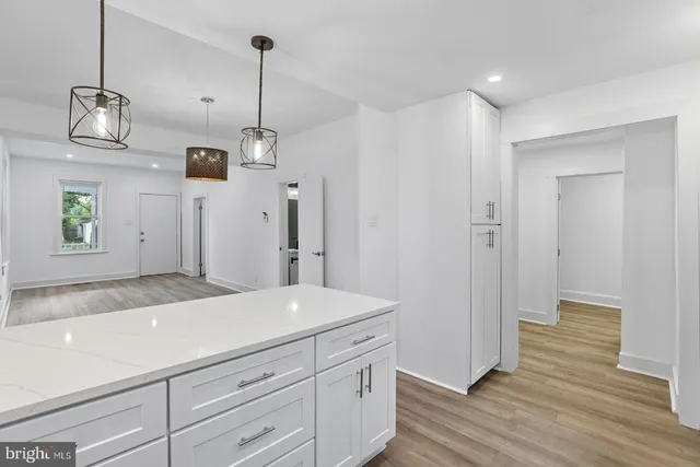 a kitchen with a refrigerator and countertop