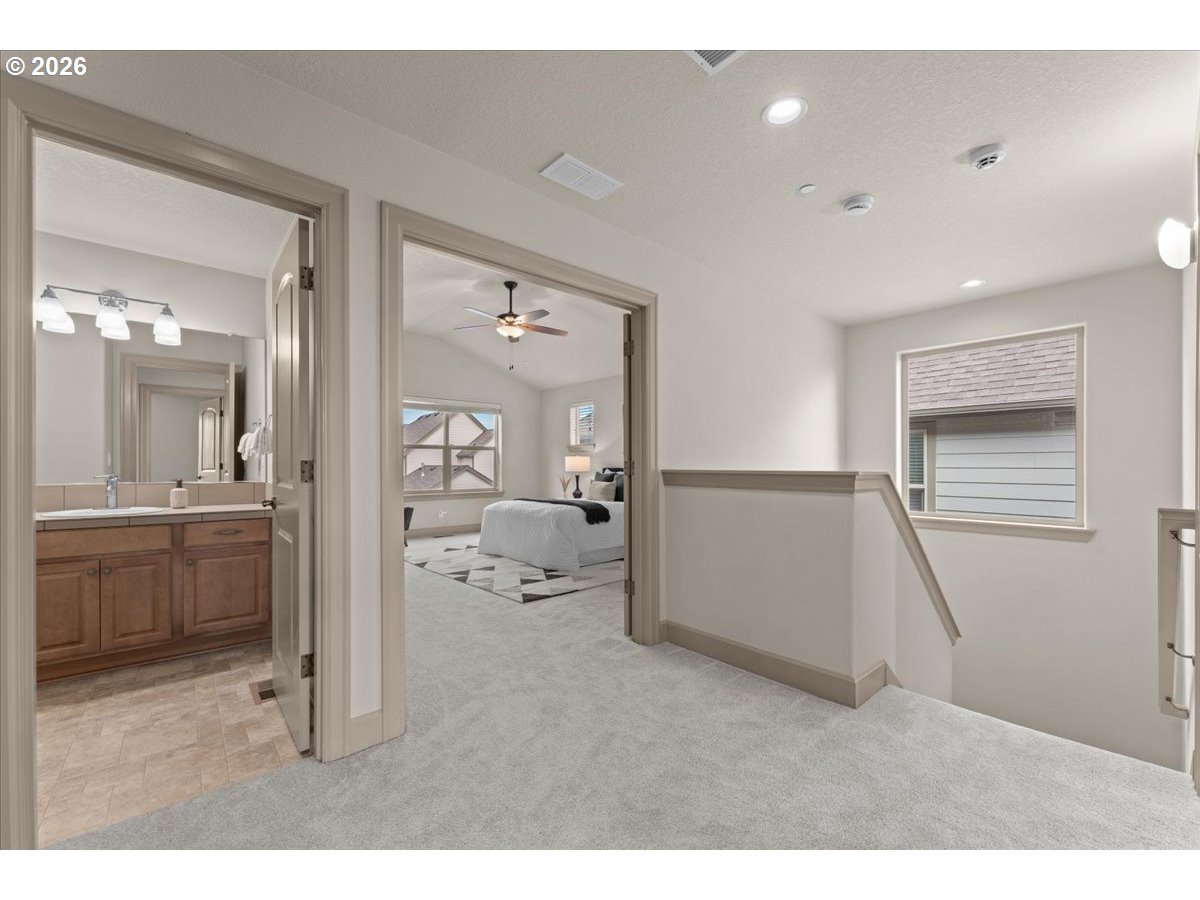 10899 Southwest Barber Street Wilsonville, OR 97070 - Photo 18 of 44 a hall way with a furniture and closet