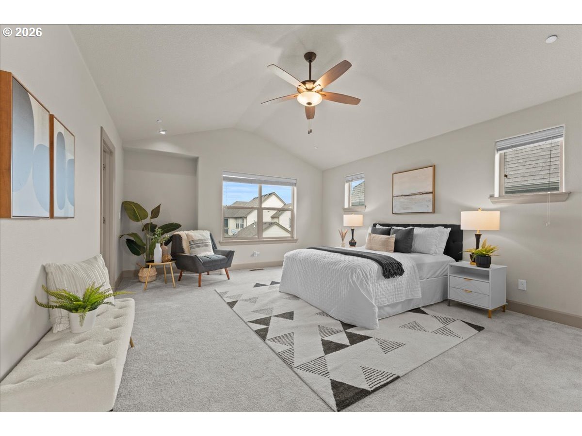 10899 Southwest Barber Street Wilsonville, OR 97070 - Photo 19 of 44 a living room with furniture and a large window