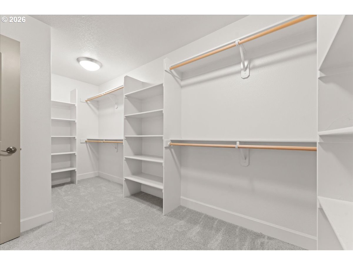 10899 Southwest Barber Street Wilsonville, OR 97070 - Photo 26 of 44 a view of walk in closet with empty racks