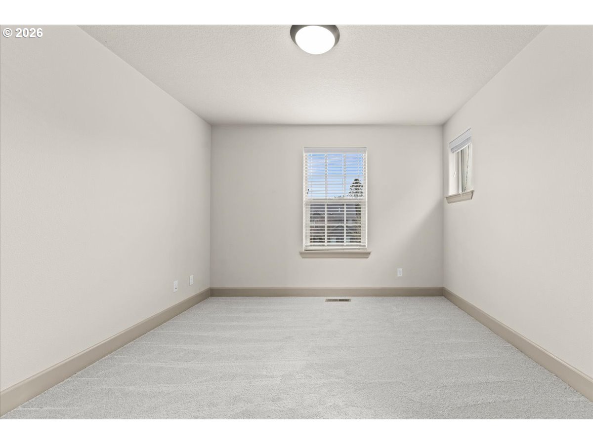 10899 Southwest Barber Street Wilsonville, OR 97070 - Photo 29 of 44 an empty room with windows
