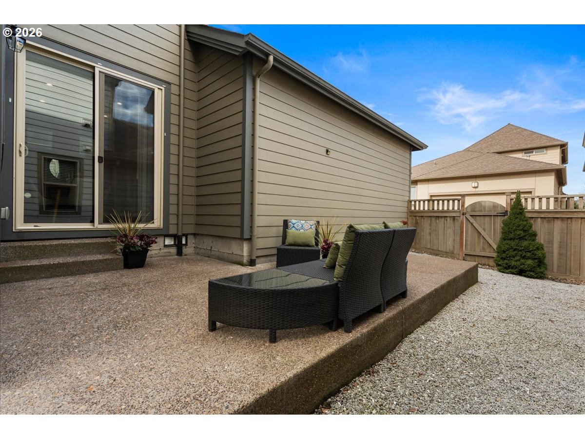 10899 Southwest Barber Street Wilsonville, OR 97070 - Photo 35 of 44 a view of a patio with couches and table and chairs with wooden floor