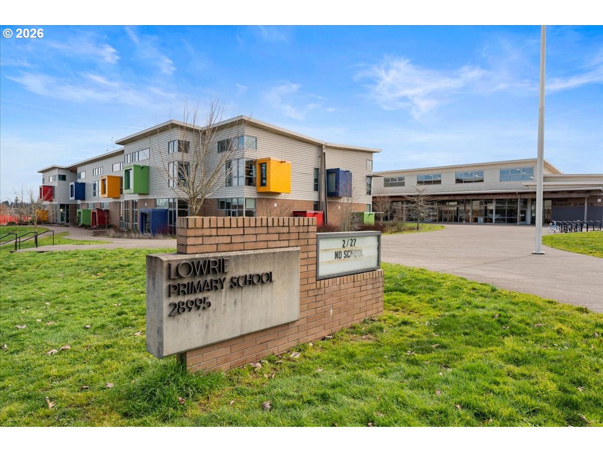 10899 Southwest Barber Street Wilsonville, OR 97070 - Photo 37 of 44 a view of a house with a yard