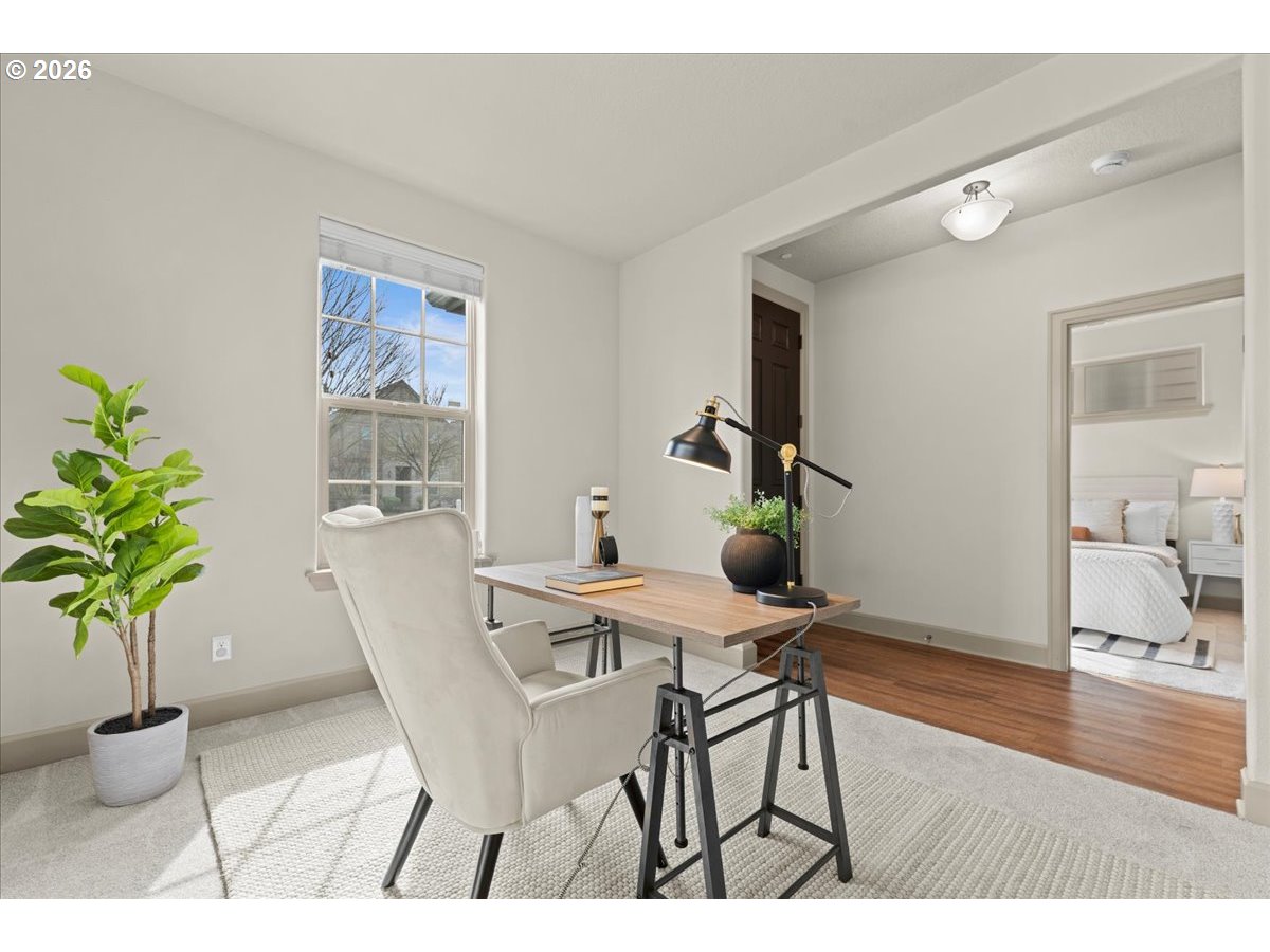 10899 Southwest Barber Street Wilsonville, OR 97070 - Photo 4 of 44 a view of a dining room with furniture and a potted plant