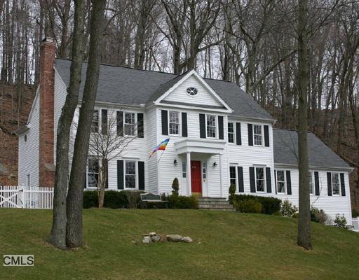 290 Oscaleta Road Ridgefield, CT 06877 - Photo 1 of 1 a front view of a house with a garden