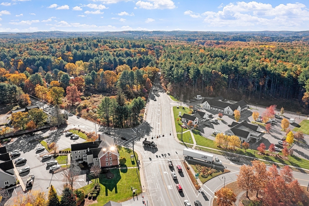 797 Boston Road Groton, MA 01450 - Photo 5 of 28 an aerial view of residential houses with outdoor space