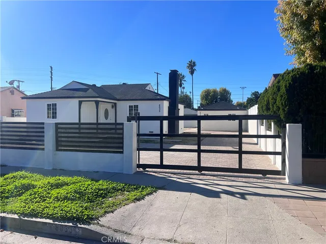 a view of a house with a street