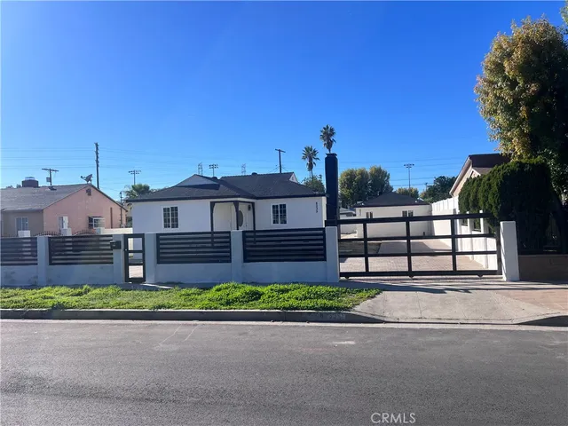 a front view of a house with a yard and a garage