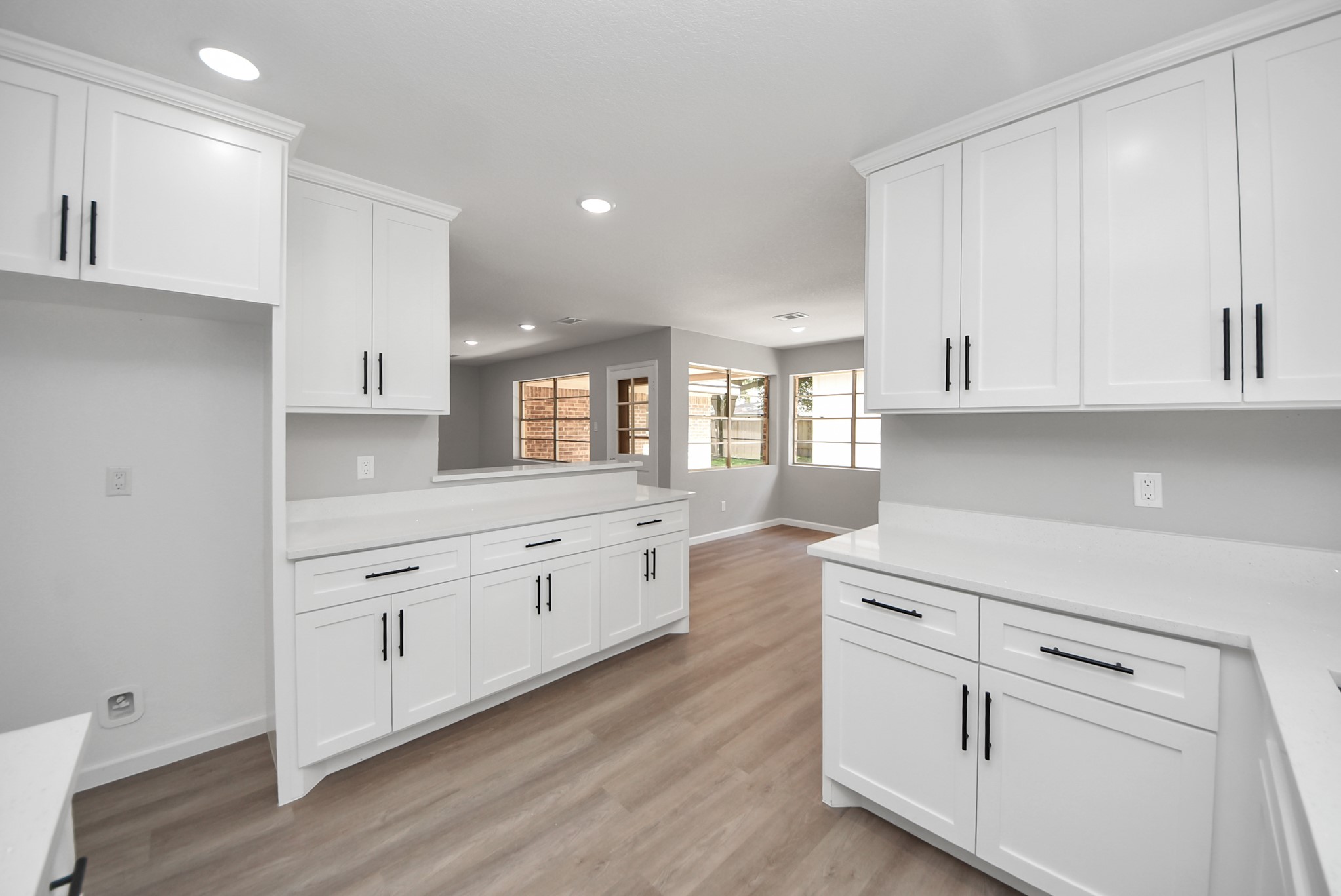 2402 Rolling Glen Drive Spring, TX 77373 - Photo 14 of 38 a kitchen with white cabinets appliances and a sink
