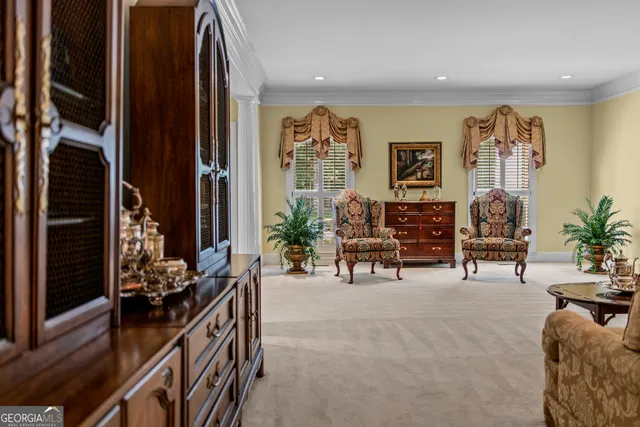 a view of a hallway with dining area and glass door